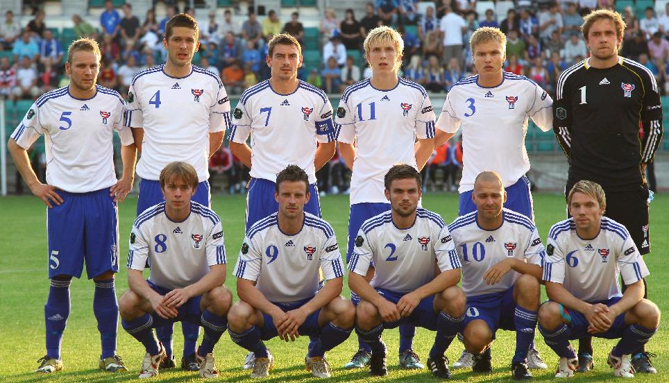 Faroe Islands-10-11-adidas-home-kit-white-blue-blue-pose.jpg